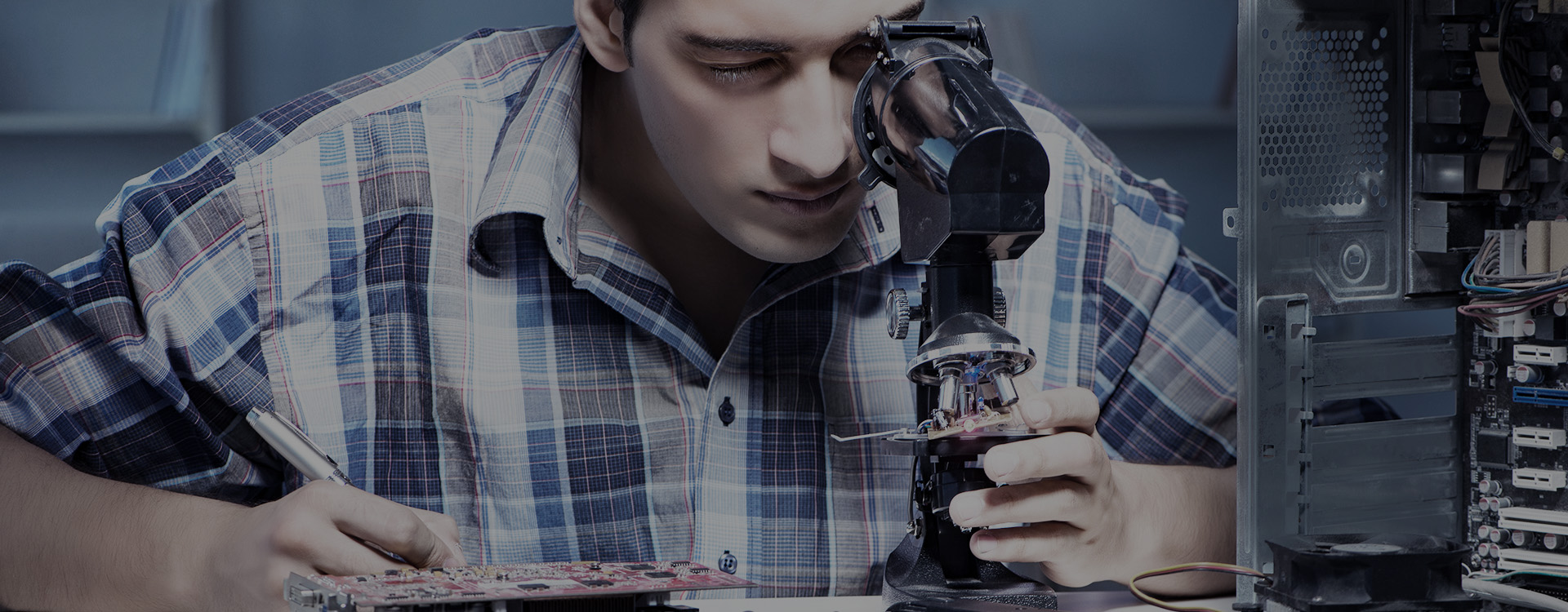 Technician Inspecting Motors with Microscope